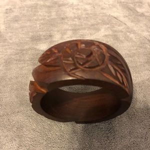Beautiful wooden bracelet with carved flowers.